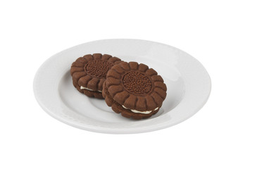Chocolate cookies on a withe plate isolated