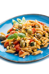 cold pasta salad with pachino olives zucchins and pine kernel