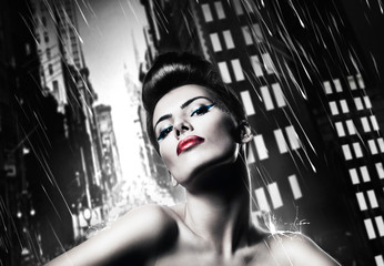 attractive brunette woman with red lips in rainy city - obrazy, fototapety, plakaty