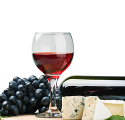 glass of red wine with grapes