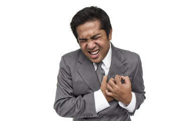 Businessman having heart attack