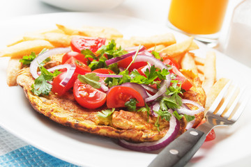 Omelet with tomato salad