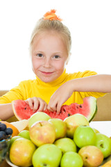 Fototapeta na wymiar Girl eats fruit