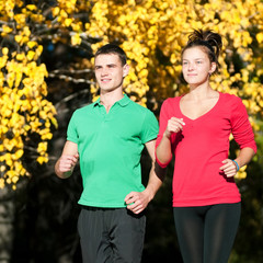 Young man and woman running