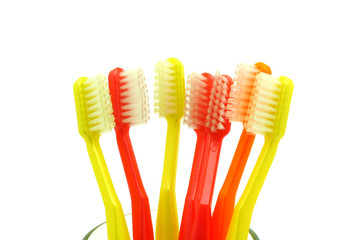 toothbrushes in a water glass