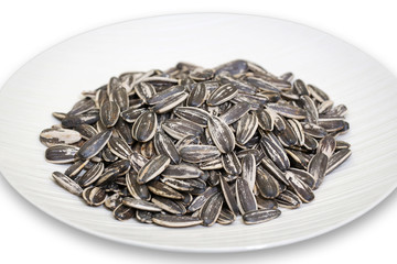 sunflower seeds on white ceramic plate