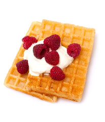 waffles with wheaped cream and raspberrries