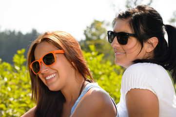 Mother and daughter relaxing in the park