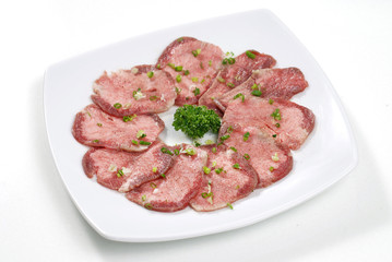 beef tongue sliced on white dish