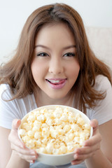 Woman teenager relax with her popcorn