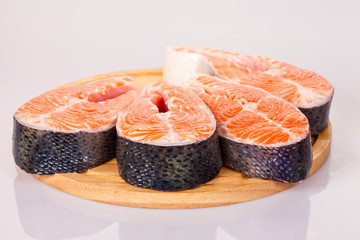  Four raw salmon steaks