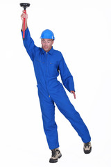 Plumber with plunger in hand