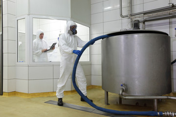 two professionals working in toxic industrial space