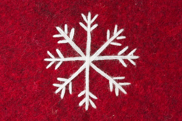 red felt with embroidered white snowflake