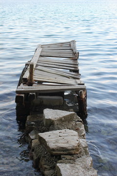 stone and wood dilapidated sailing jetty