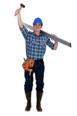 Happy manual worker raising hammer above head
