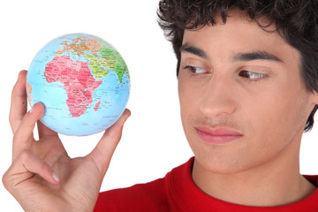 Teen with globe in hand