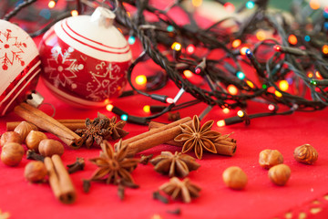 Closeup of spices and Christmas decorations in the background