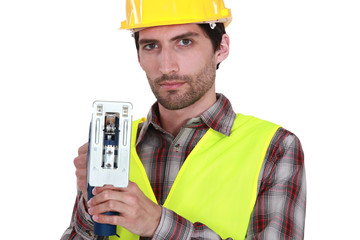 A manual worker with a jigsaw.
