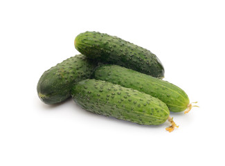green cucumbers on white