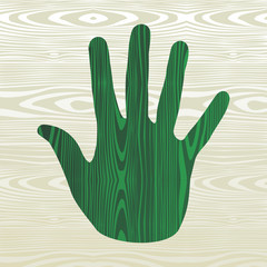 Green hand in wood
