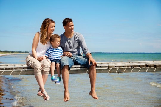 Small Family of Three by the Beach