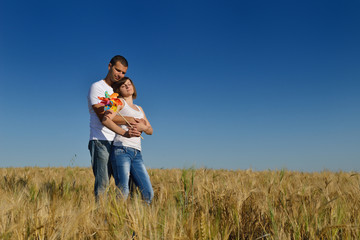 happy couple in wheat field