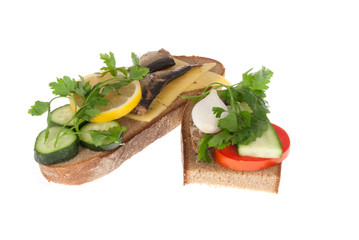 Two bits rye-bread with canned fish and cheese