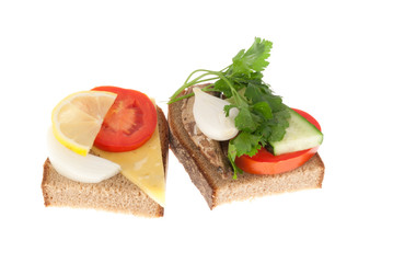 Two bits rye-bread with canned fish and cheese