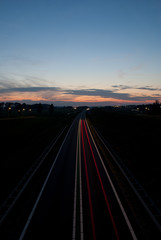 Fototapeta na wymiar Lights of evening traffic