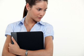 Businesswoman holding a folder.