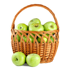 Green apples in basket isolated on white background