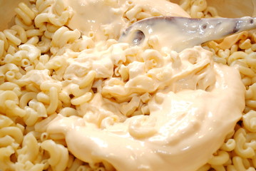 Mixing Mayo in Elbow Pasta for a Pasta Salad
