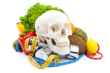 fitness dumbbells ,human scull and fruits