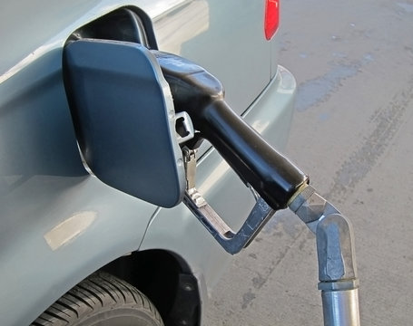 Car Getting Fueled At Gas Station