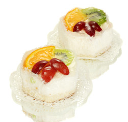 sweet cakes with fruits isolated on white