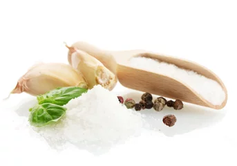 Deurstickers salt with fresh basil, garlic and pepper isolated on white © Africa Studio