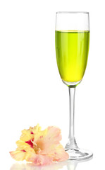 glass with cocktail and gladiolus bud isolated on white