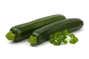 Zucchini courgette with parsley isolated on white