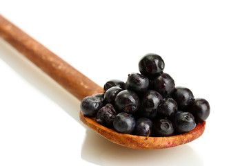 blueberries in wooden spoon isolated on white