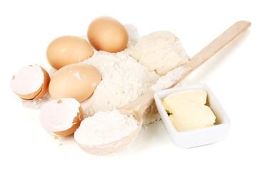 Eggs, flour and butter isolated on white