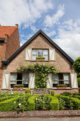 Fototapeta na wymiar beautiful rural, brick house in the Dutch style