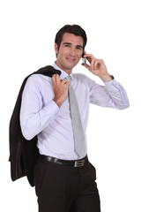 Naklejka premium Businessman talking on his mobile phone