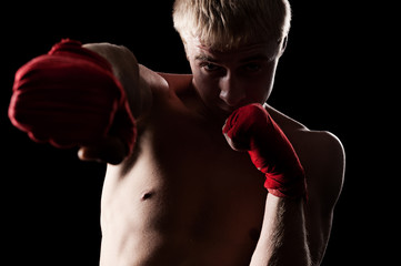caucasian boxer with red bandage
