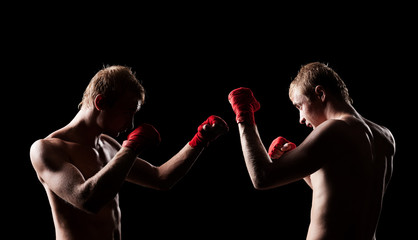 Fototapeta na wymiar two boxers facing each other