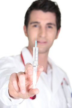 Doctor with an hypodermic needle