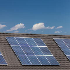 Fototapeta premium Grouped solar panels on a roof