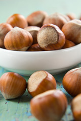 Hazelnuts (filbert) on the vintage wooden surface