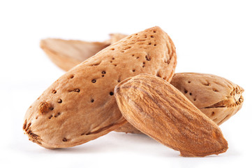 Group of almond nuts. Isolated on a white background