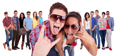 happy couple making the rock and roll gesture